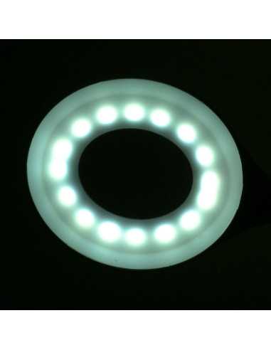 Lampe annulaire LED serpent sur le bureau blanc