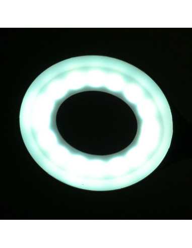 Lampe annulaire LED serpent sur le bureau blanc