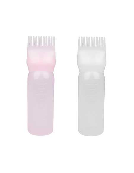 Une bouteille avec un peigne pour appliquer des peintures de couleurs mélangées 