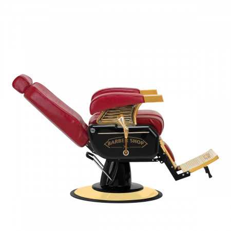 Vista inclinata rossa della maestosa sedia da barbiere Gold