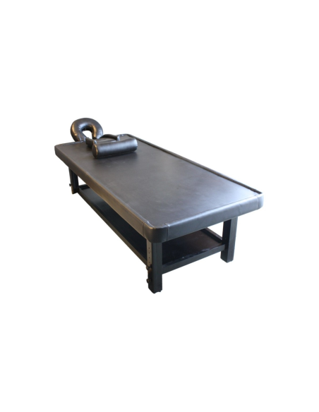 Table de massage ayurvédique en bois foncé, confort et design pour esthéticiennes