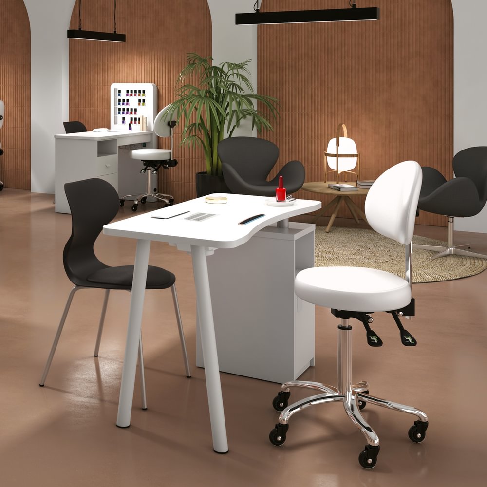 Showroom onglerie moderne GOLDBEAUTE avec table de manucure blanche, fauteuil ergonomique professionnel et mobilier design haut de gamme pour institut de beauté.