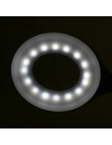 Lampe annulaire LED serpent sur le bureau blanc